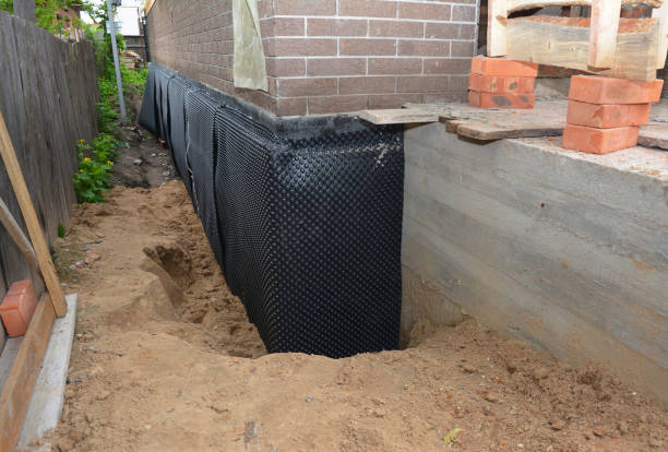 Happy homeowners after waterproofing job in Norwood
